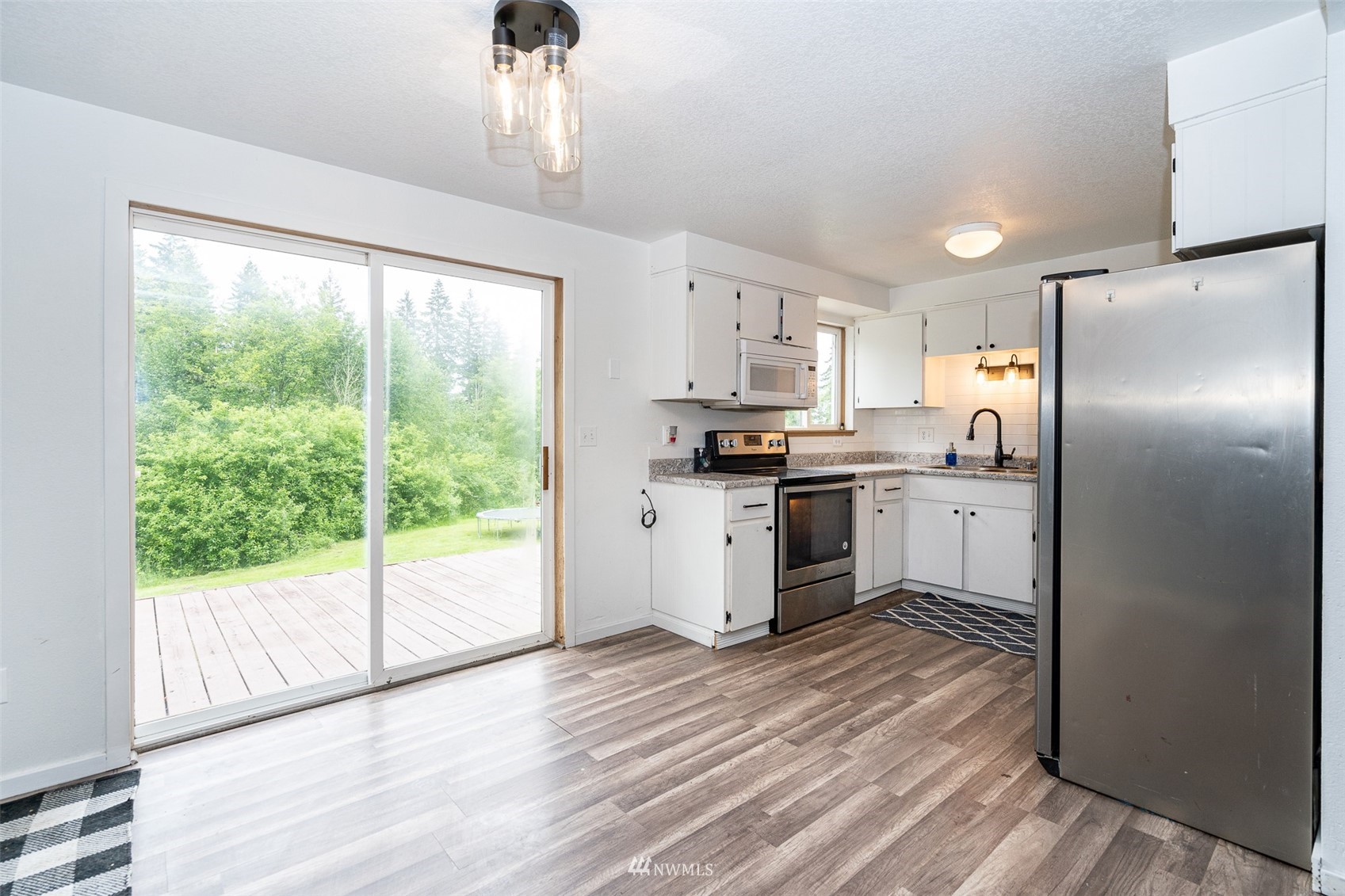 181 Crego Ridge Road Chehalis, WA 98532 - Photo 7 of 33 a kitchen with stainless steel appliances a refrigerator sink and cabinets