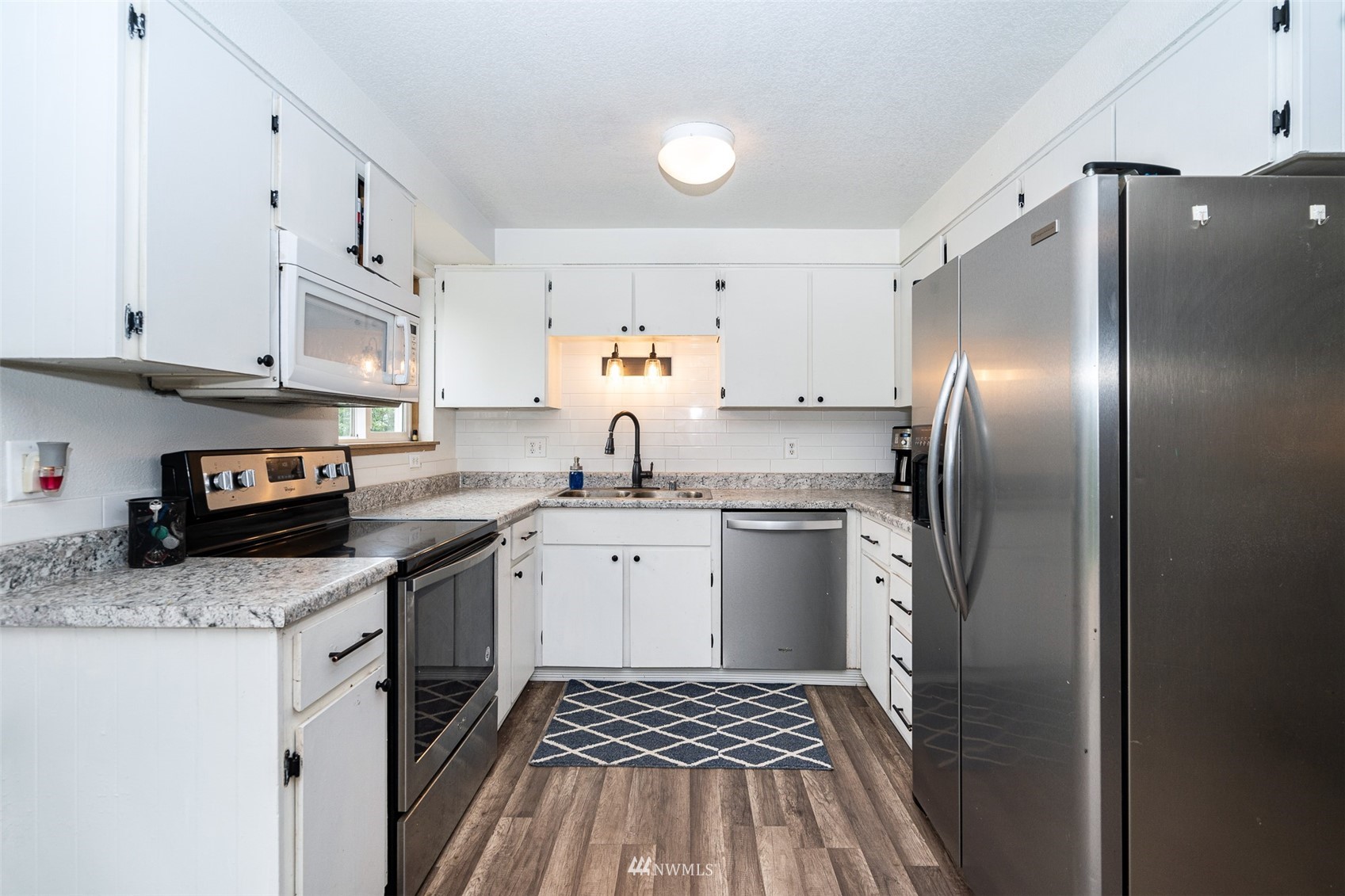 181 Crego Ridge Road Chehalis, WA 98532 - Photo 8 of 33 a kitchen with stainless steel appliances granite countertop a refrigerator sink and stove