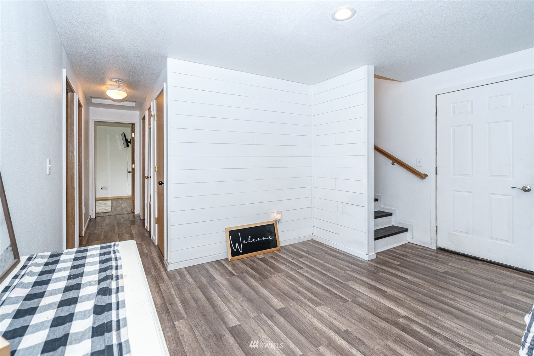 181 Crego Ridge Road Chehalis, WA 98532 - Photo 9 of 33 a bedroom with a bed and wooden floor