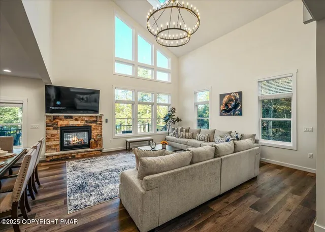 a kitchen with refrigerator a sink and chairs
