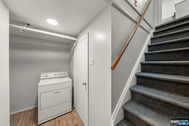 a view of storage and utility room with washer and dryer