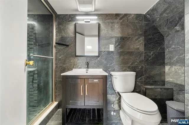 a bathroom with a toilet and a sink