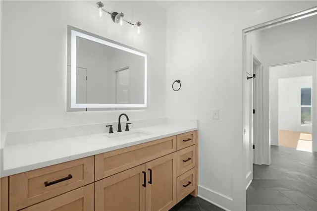 a bathroom with a double vanity sink and mirror