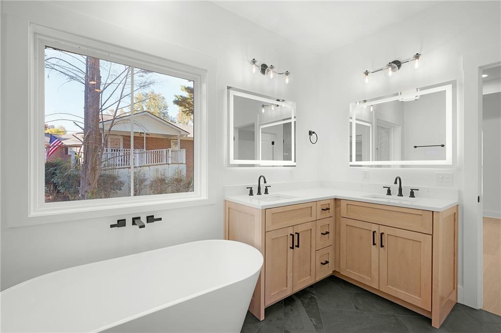 130 Cambridge Court Calhoun, GA 30701 - Photo 34 of 46 a bathroom with a tub a sink and a window