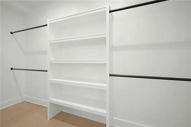 a view of an empty walk in closet