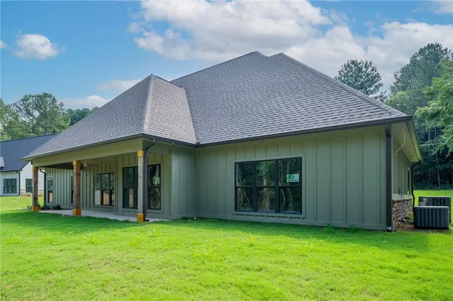 a view of a house with garden and porch