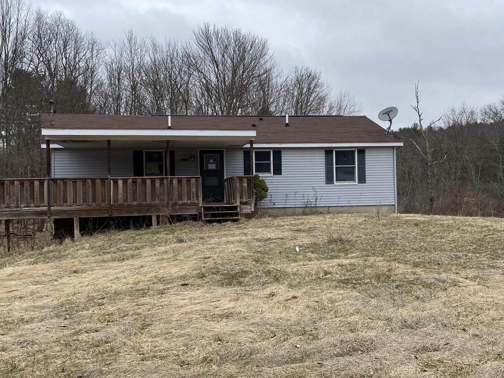 a house with trees in the background