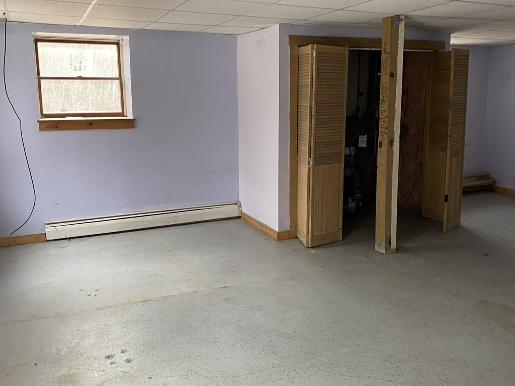 245 Brookfield Road Brimfield, MA 01010 - Photo 17 of 17 an empty room with windows