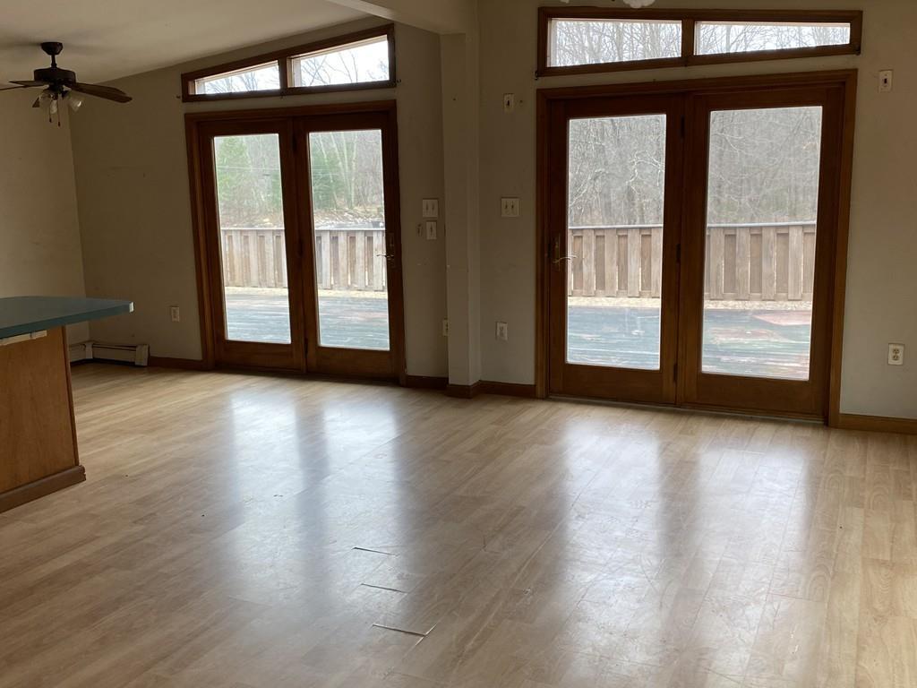 245 Brookfield Road Brimfield, MA 01010 - Photo 9 of 17 an empty room with wooden floor and windows