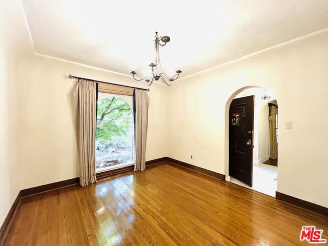 a kitchen with stainless steel appliances a refrigerator and a stove top oven