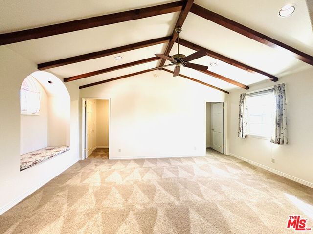 a kitchen with a refrigerator and a sink
