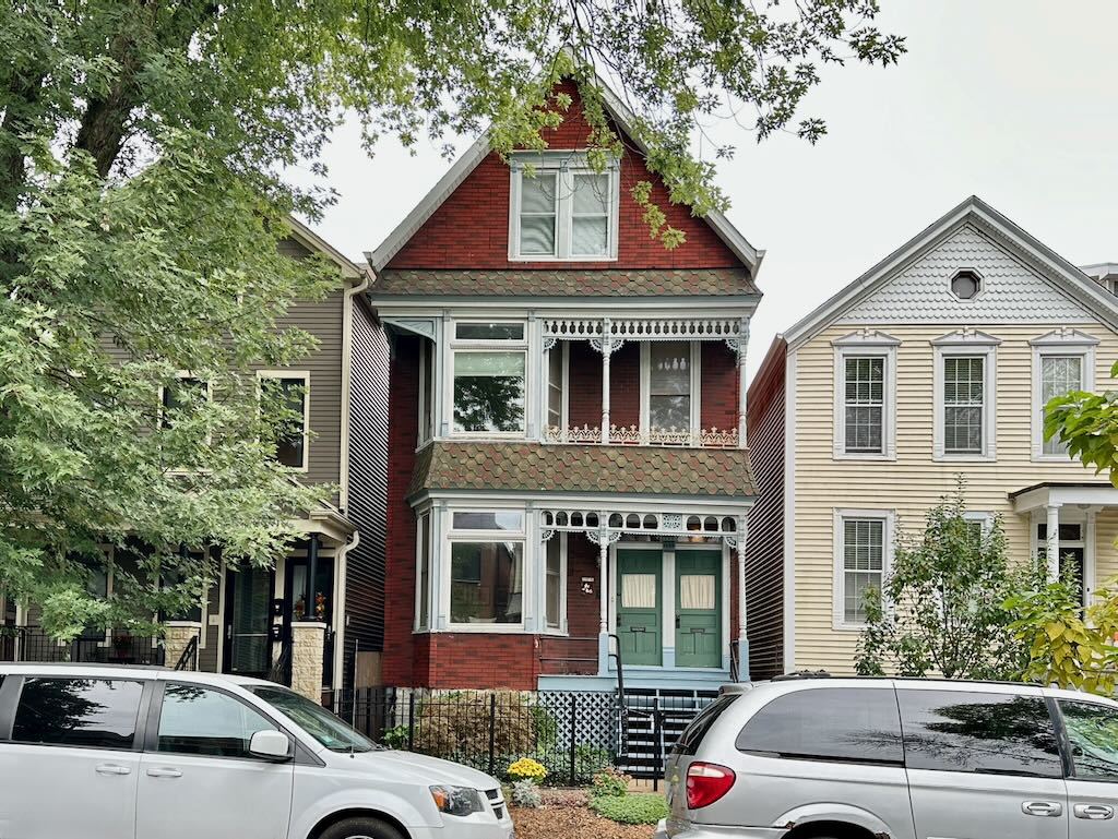 a view of a car parked in front of a house