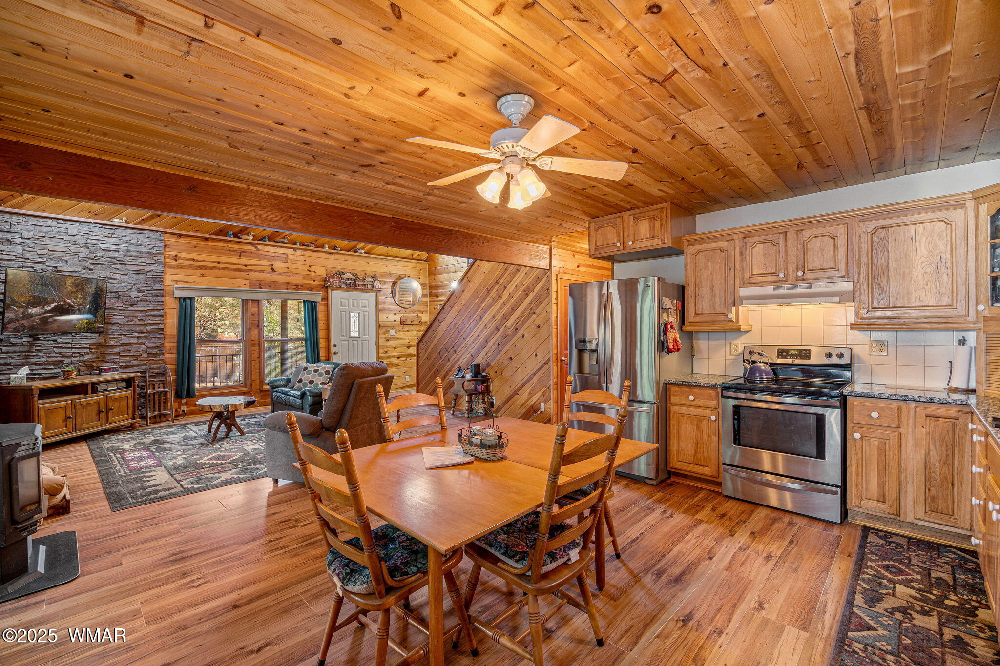 2933 Wildcat Trail Overgaard, AZ 85933 - Photo 13 of 44 a view of a dining room with furniture window and wooden floor