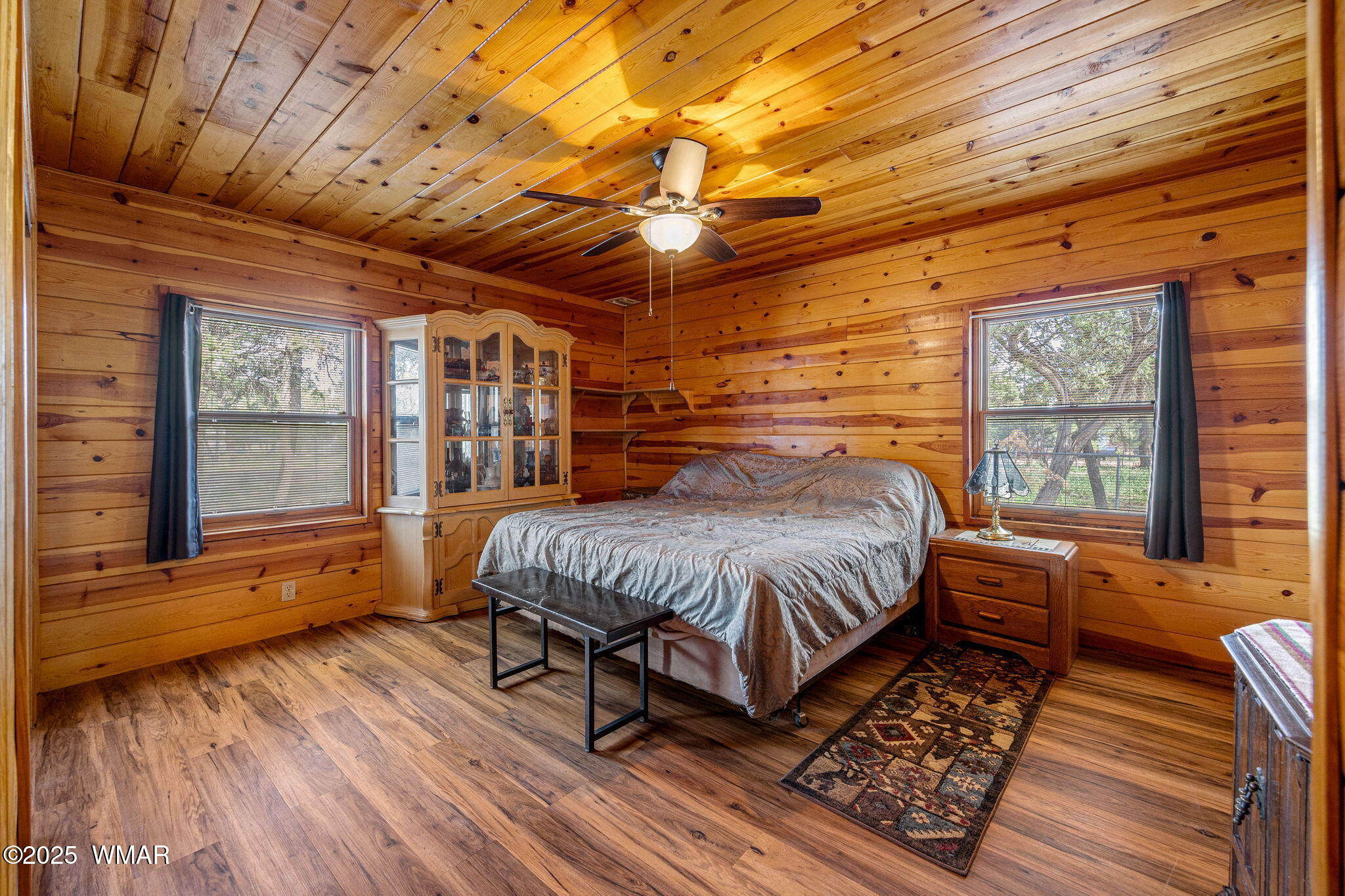 2933 Wildcat Trail Overgaard, AZ 85933 - Photo 17 of 44 a bedroom with a bed wooden floor and window