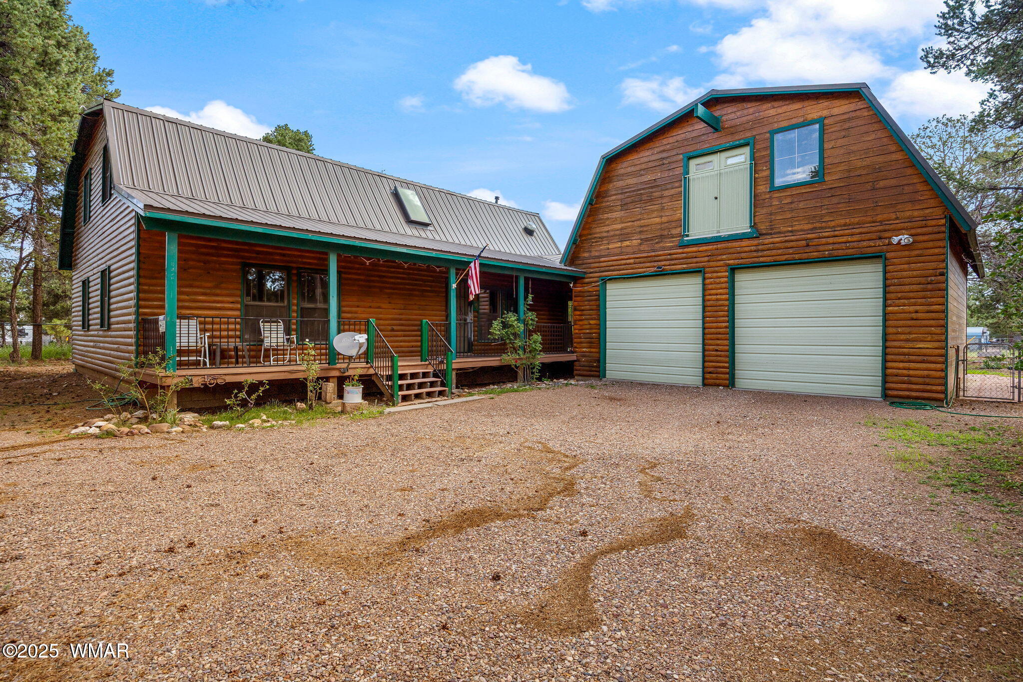 2933 Wildcat Trail Overgaard, AZ 85933 - Photo 2 of 44 a view of a house with a yard and garage