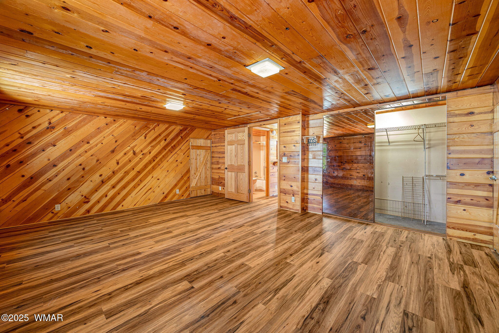 2933 Wildcat Trail Overgaard, AZ 85933 - Photo 26 of 44 a view of empty room with wooden floor