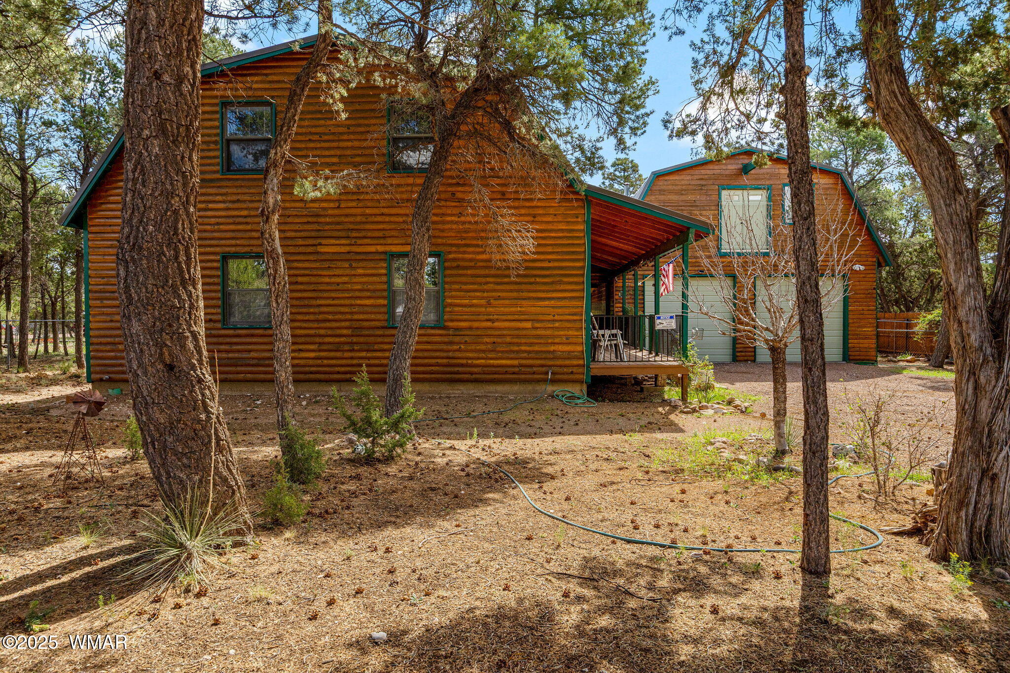 2933 Wildcat Trail Overgaard, AZ 85933 - Photo 3 of 44 a view of a house with a snow in the yard