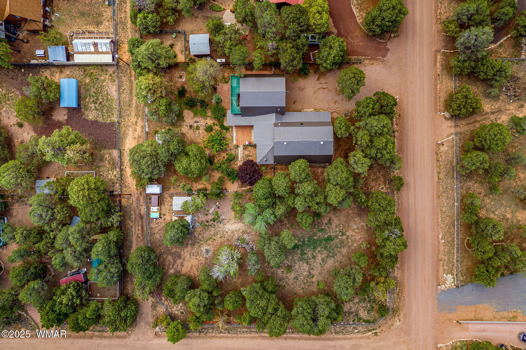 2933 Wildcat Trail Overgaard, AZ 85933 - Photo 39 of 44 an aerial view of a house with a yard and potted plants