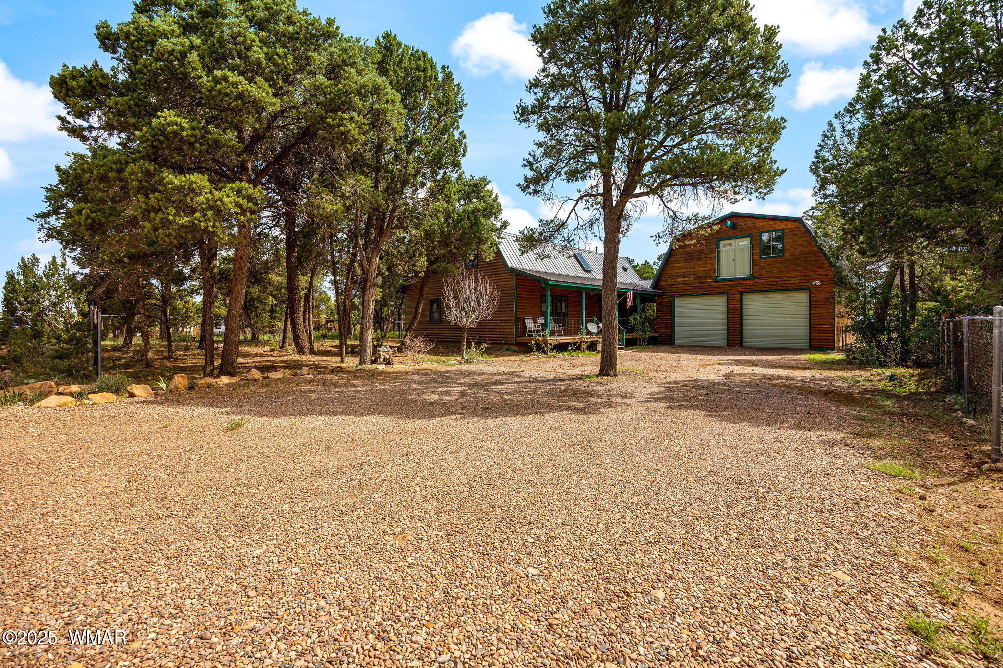 2933 Wildcat Trail Overgaard, AZ 85933 - Photo 6 of 44 a view of large building with a large tree