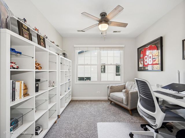 a bedroom with furniture and a chandelier
