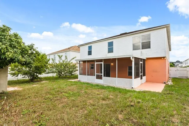 a view of a house with garden and yard