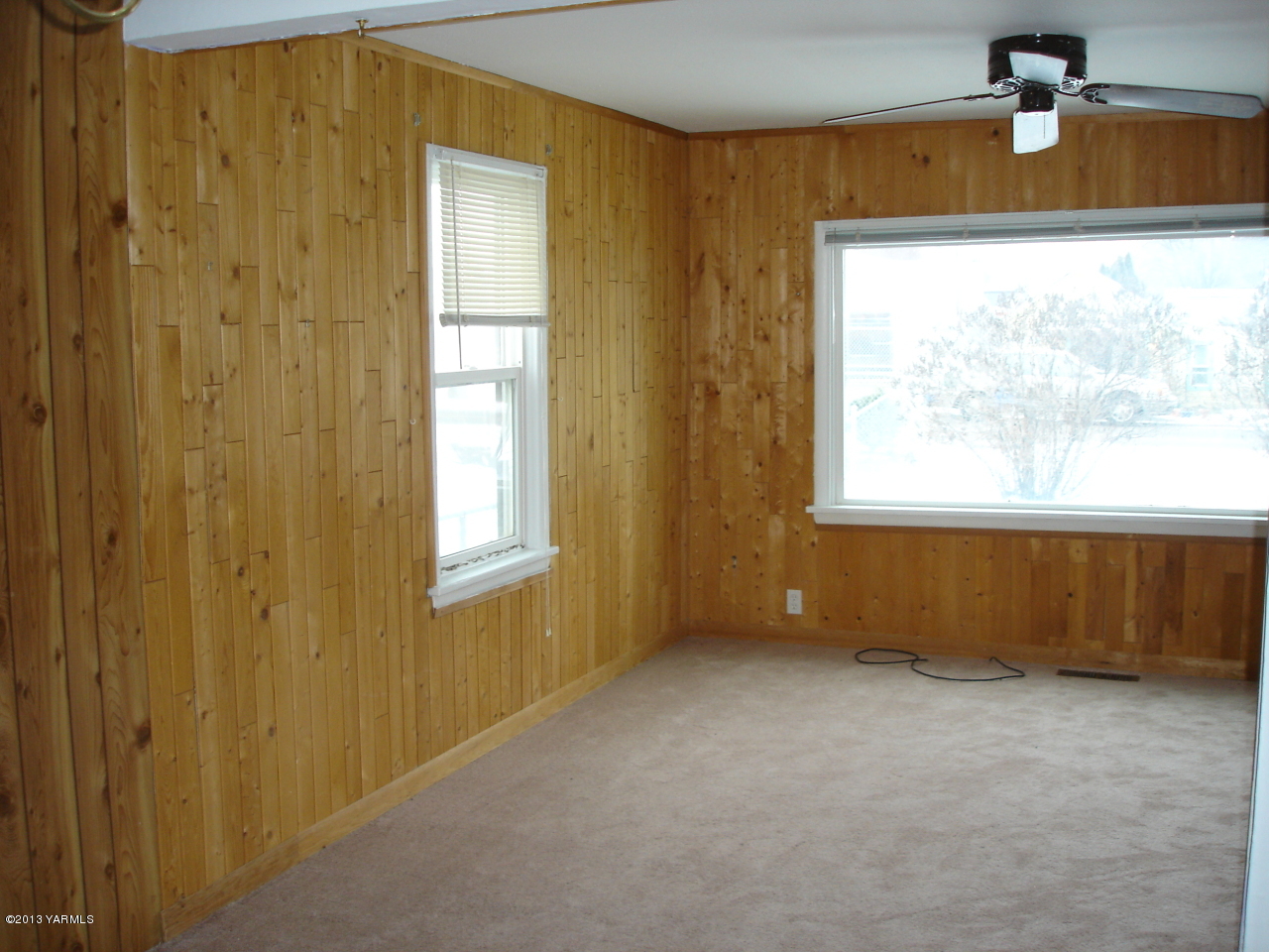10608 Hughes Road Yakima, WA 98903 - Photo 3 of 10 a view of an empty room with a window