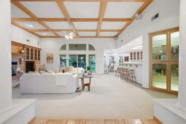 a kitchen with a sink cabinets and wooden floor