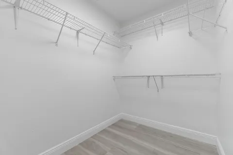 a view of a room with racks on the wall