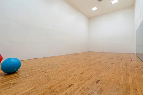 a view of an empty room and wooden floor