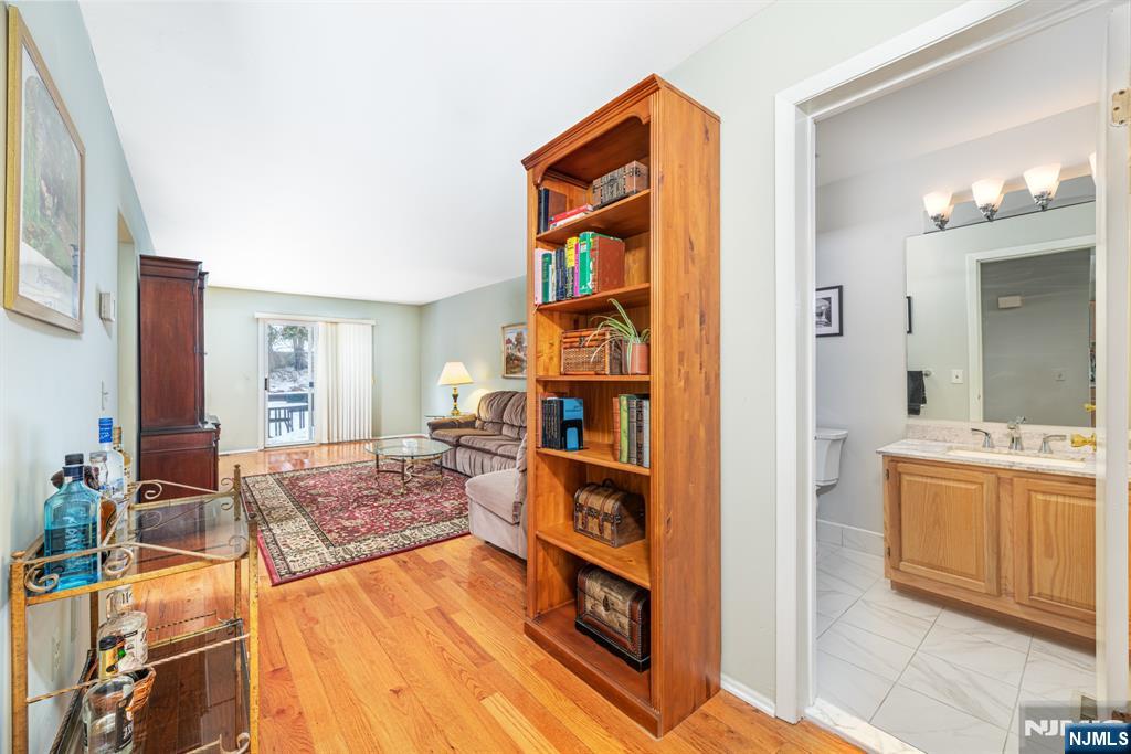 44 Mill Pond Road Little Falls, NJ 07424 - Photo 11 of 37 a living room with furniture and a kitchen view