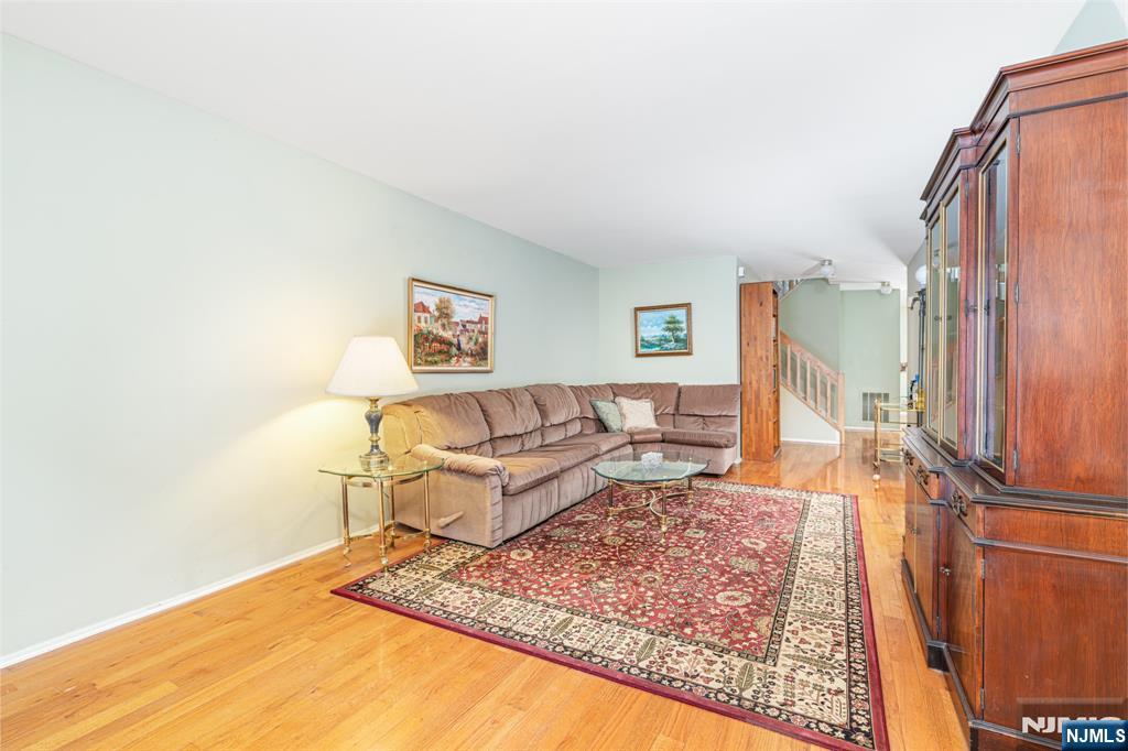 44 Mill Pond Road Little Falls, NJ 07424 - Photo 15 of 37 a living room with a couch and a rug