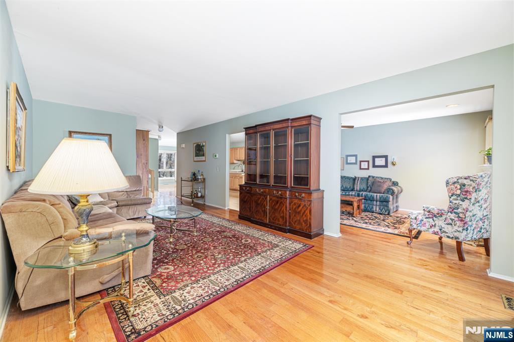 44 Mill Pond Road Little Falls, NJ 07424 - Photo 16 of 37 a living room with furniture and a table