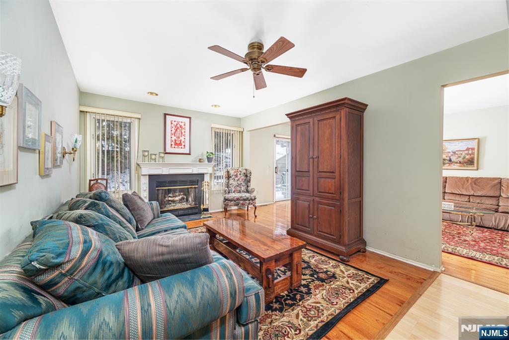 44 Mill Pond Road Little Falls, NJ 07424 - Photo 17 of 37 a living room with furniture and a fireplace
