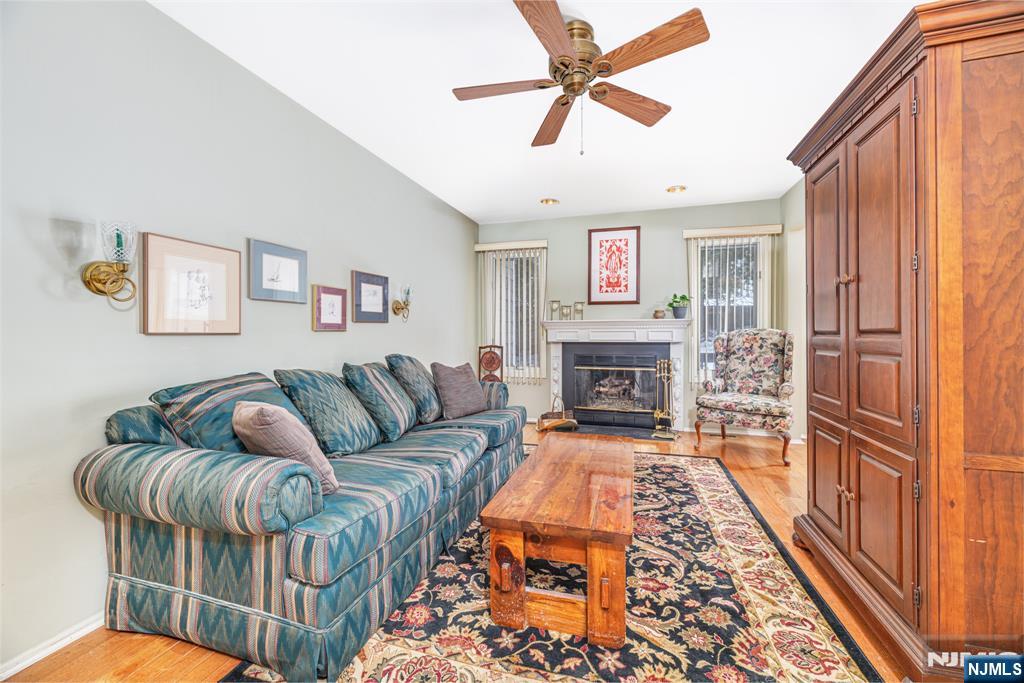 44 Mill Pond Road Little Falls, NJ 07424 - Photo 18 of 37 a living room with furniture and a fireplace