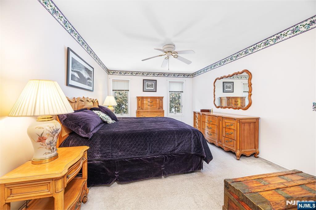 44 Mill Pond Road Little Falls, NJ 07424 - Photo 24 of 37 a spacious bedroom with a bed and window