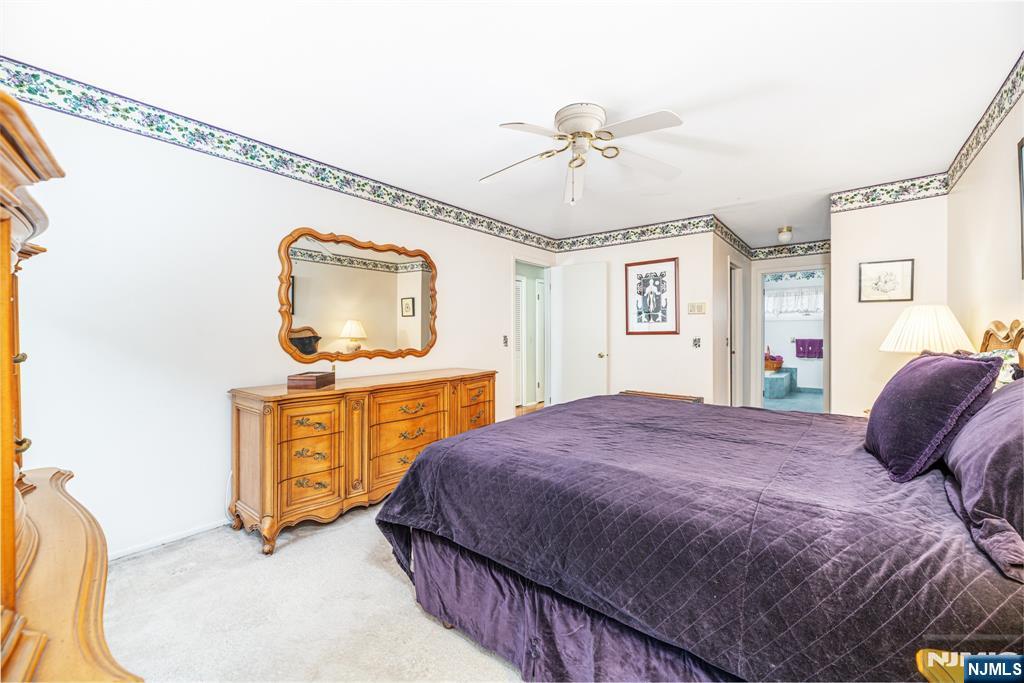 44 Mill Pond Road Little Falls, NJ 07424 - Photo 25 of 37 a bedroom with a bed and a dresser