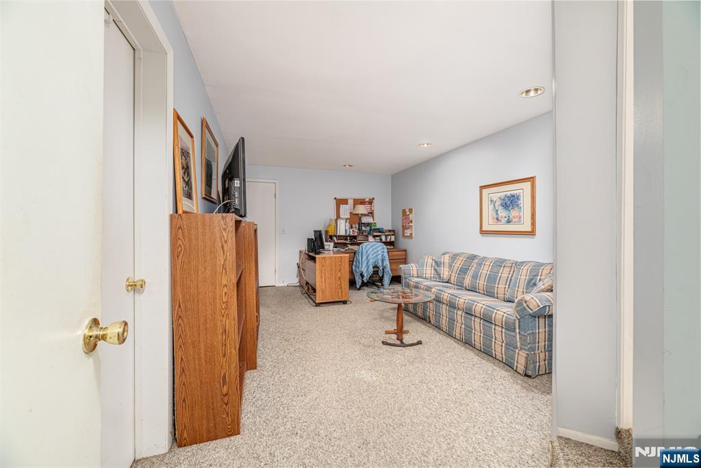 44 Mill Pond Road Little Falls, NJ 07424 - Photo 31 of 37 a living room with furniture and a bed