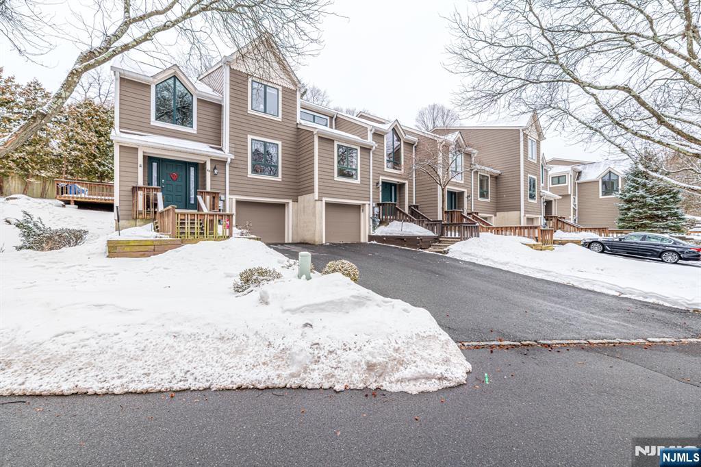 44 Mill Pond Road Little Falls, NJ 07424 - Photo 34 of 37 a view of a building with snow on the road