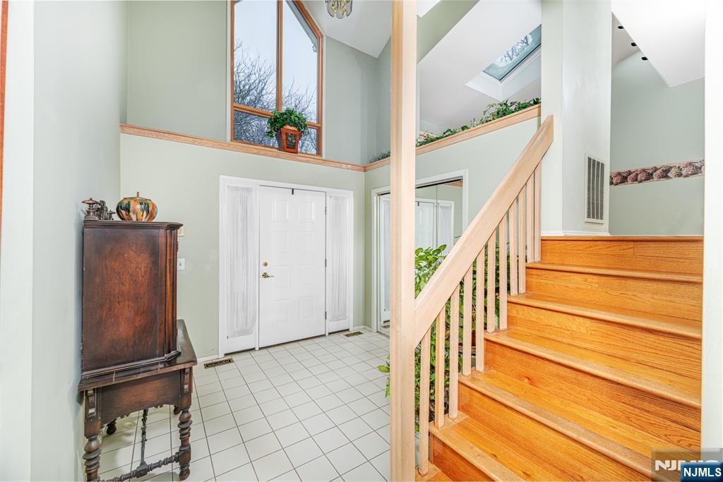 44 Mill Pond Road Little Falls, NJ 07424 - Photo 5 of 37 a view of entryway and hall with wooden floor