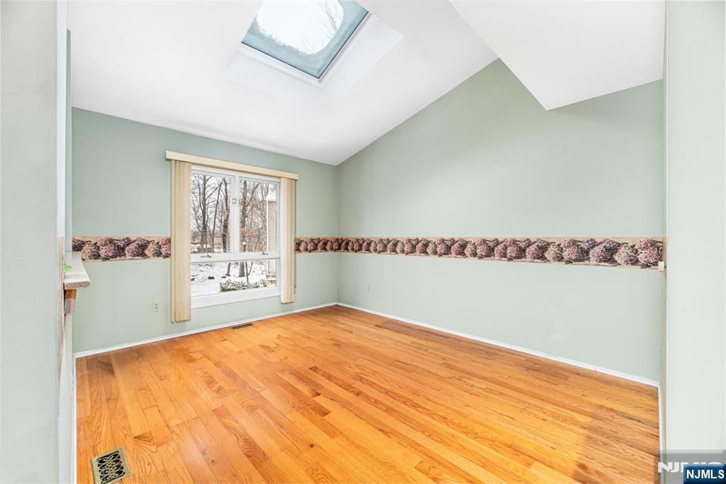 44 Mill Pond Road Little Falls, NJ 07424 - Photo 6 of 37 a view of an empty room and window