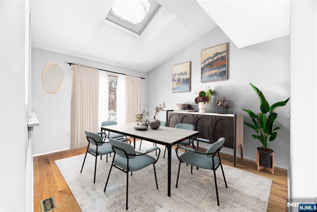 44 Mill Pond Road Little Falls, NJ 07424 - Photo 7 of 37 a view of a dining room with furniture and a potted plant