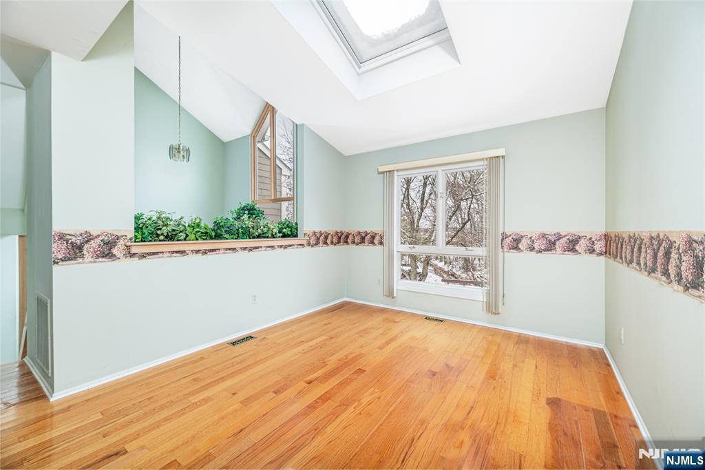 44 Mill Pond Road Little Falls, NJ 07424 - Photo 8 of 37 a view of a bedroom with wooden floor and small space