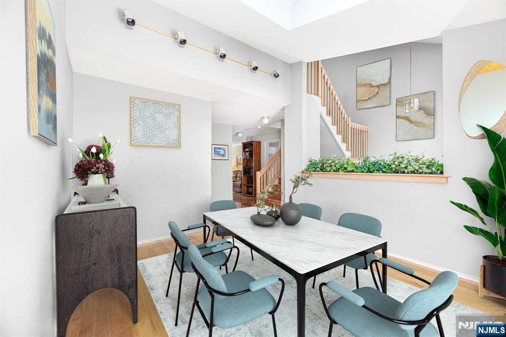 44 Mill Pond Road Little Falls, NJ 07424 - Photo 9 of 37 a view of a dining room with furniture and wooden floor