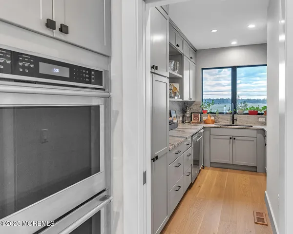 a bathroom with a toilet a sink and a window