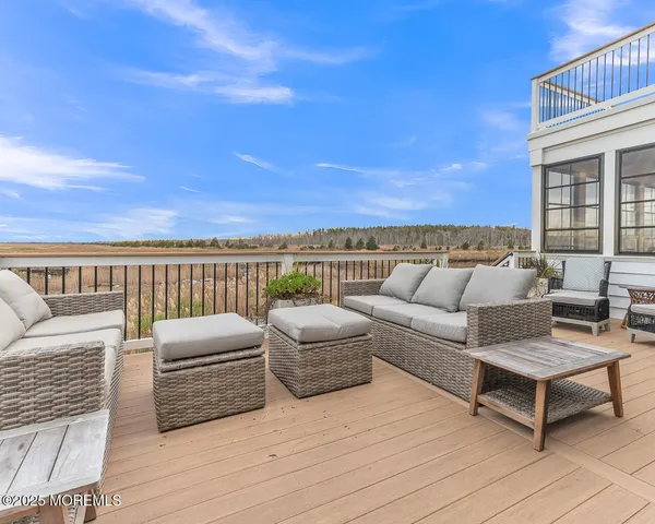 a spacious bedroom with a large bed and a large window