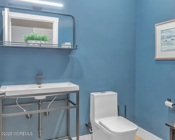 a bedroom with a bed and a night stand