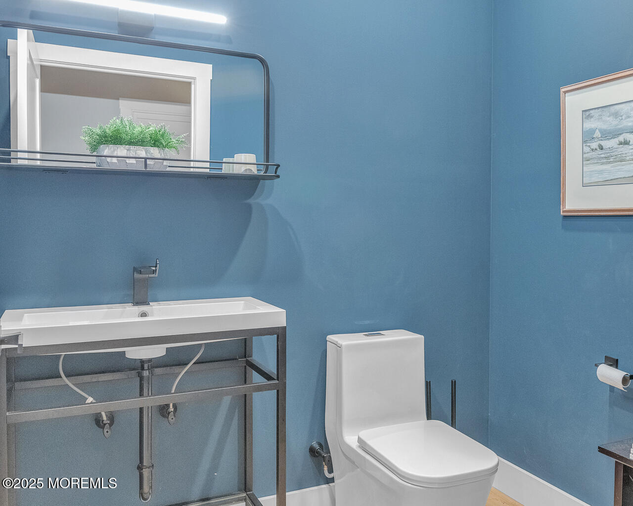 637 Cedar Run Dock Road West Creek, NJ 08092 - Photo 17 of 51 a bathroom with a toilet a sink and a window