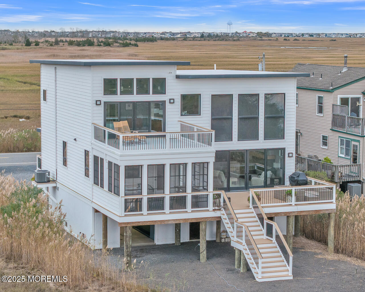 637 Cedar Run Dock Road West Creek, NJ 08092 - Photo 2 of 51 a view of a large building with a balcony