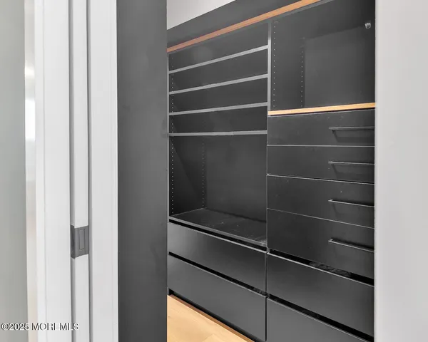 a workspace with a flat screen tv and a window