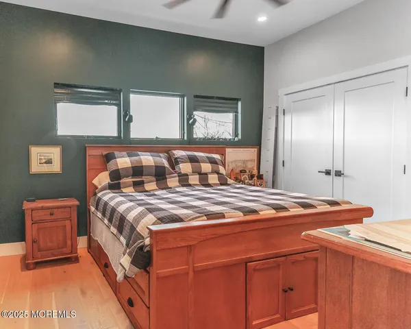 a bedroom with a bed and with lamp